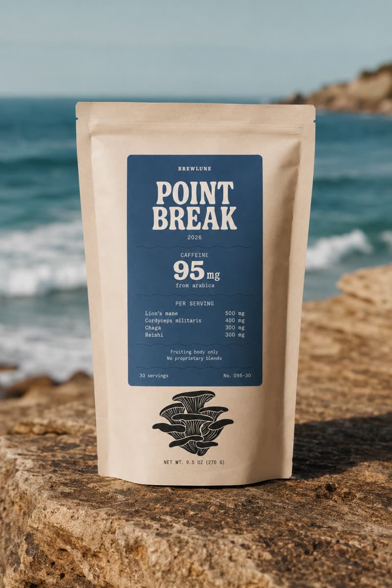 Point Break pouch on a rock above the surf, its dose table printed on the front